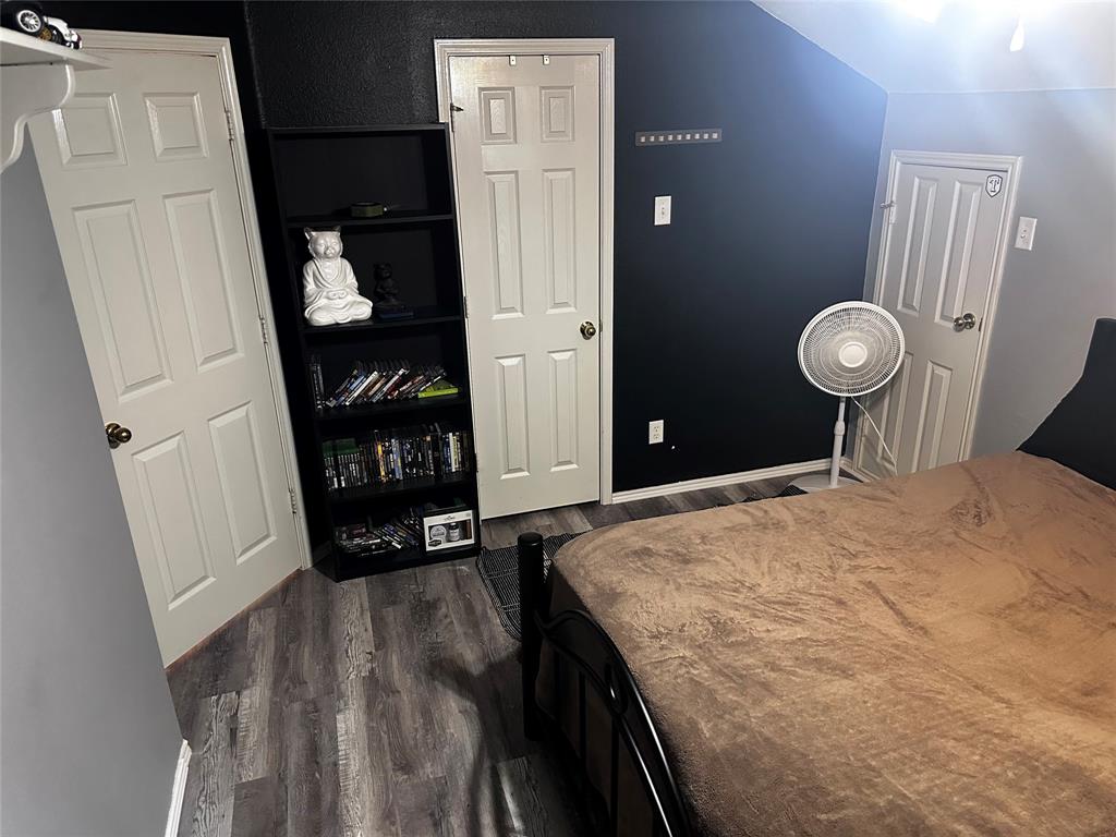 103 Denali Court Terrell, TX 75160 - Photo 32 of 39 a bedroom with a bed and a book shelf