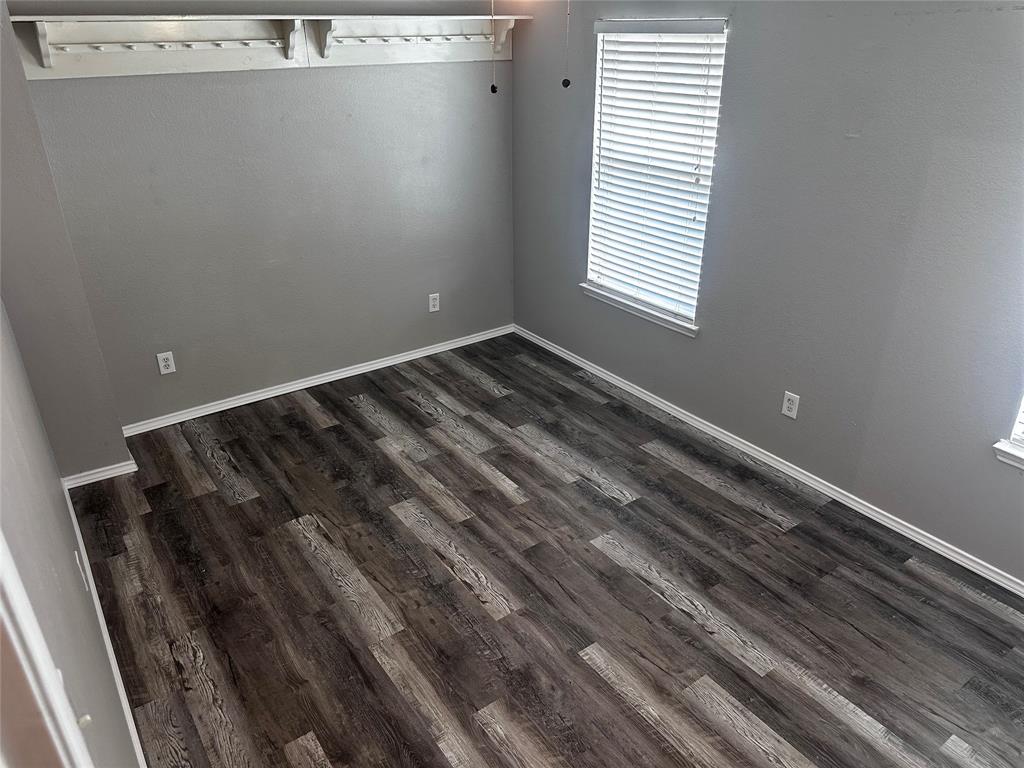 103 Denali Court Terrell, TX 75160 - Photo 35 of 39 a view of a room with wooden floor and window