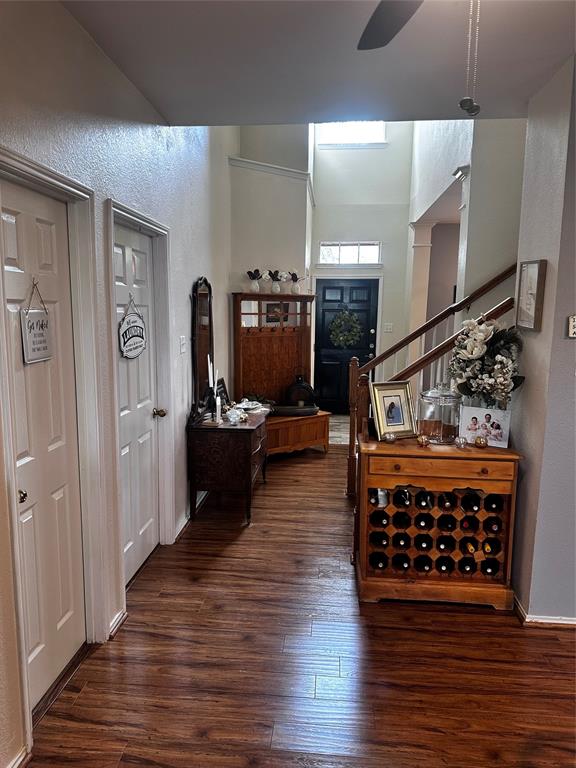 103 Denali Court Terrell, TX 75160 - Photo 7 of 39 a view of a hallway with wooden floor and furniture