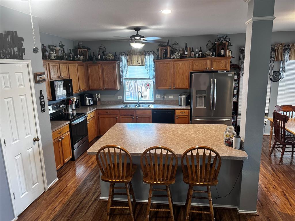 103 Denali Court Terrell, TX 75160 - Photo 10 of 39 a view of a dining room with furniture and wooden floor