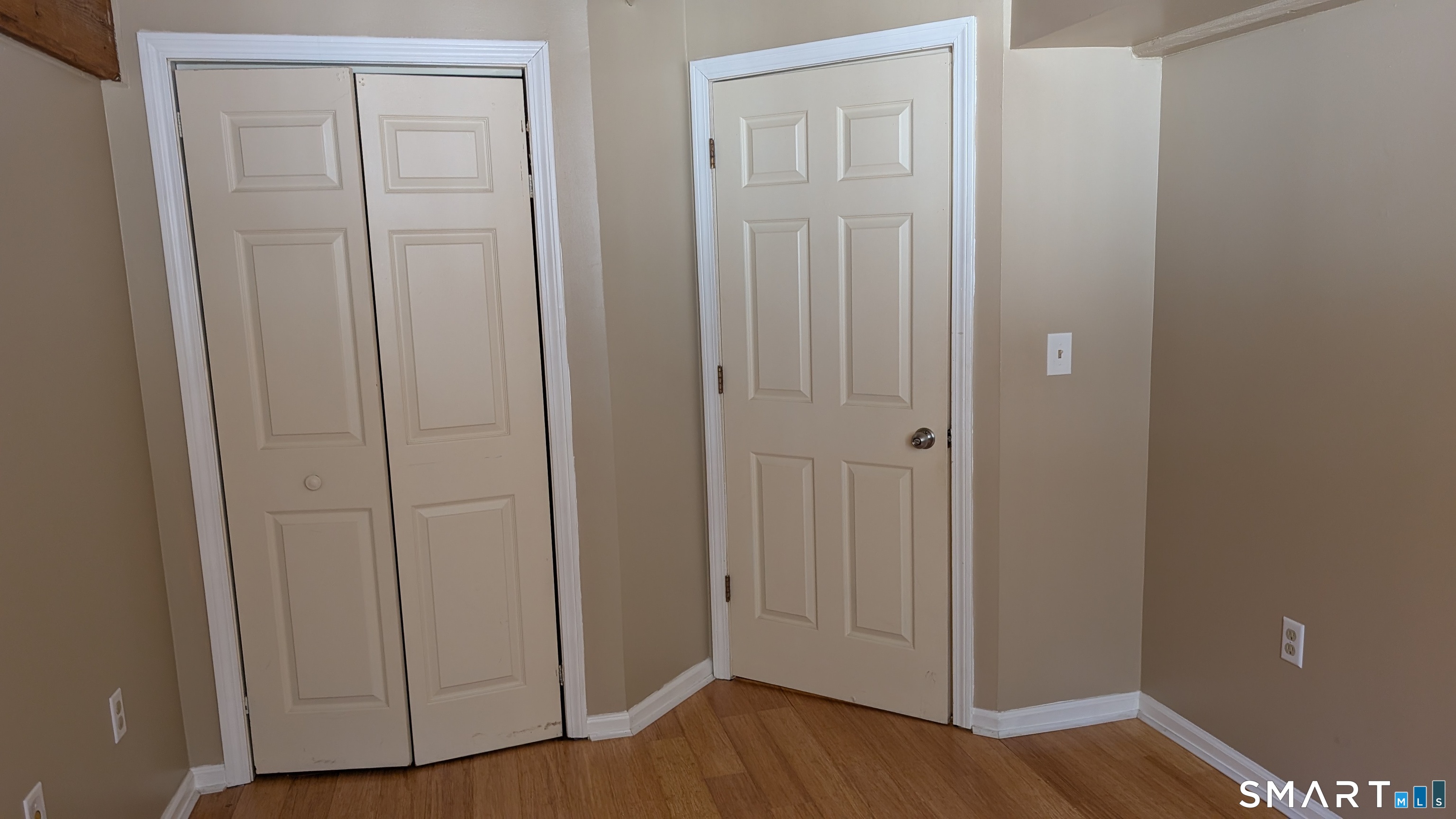 839 Main Street, Unit 98 Torrington, CT 06790 - Photo 15 of 49 a view of a hallway with wooden floor