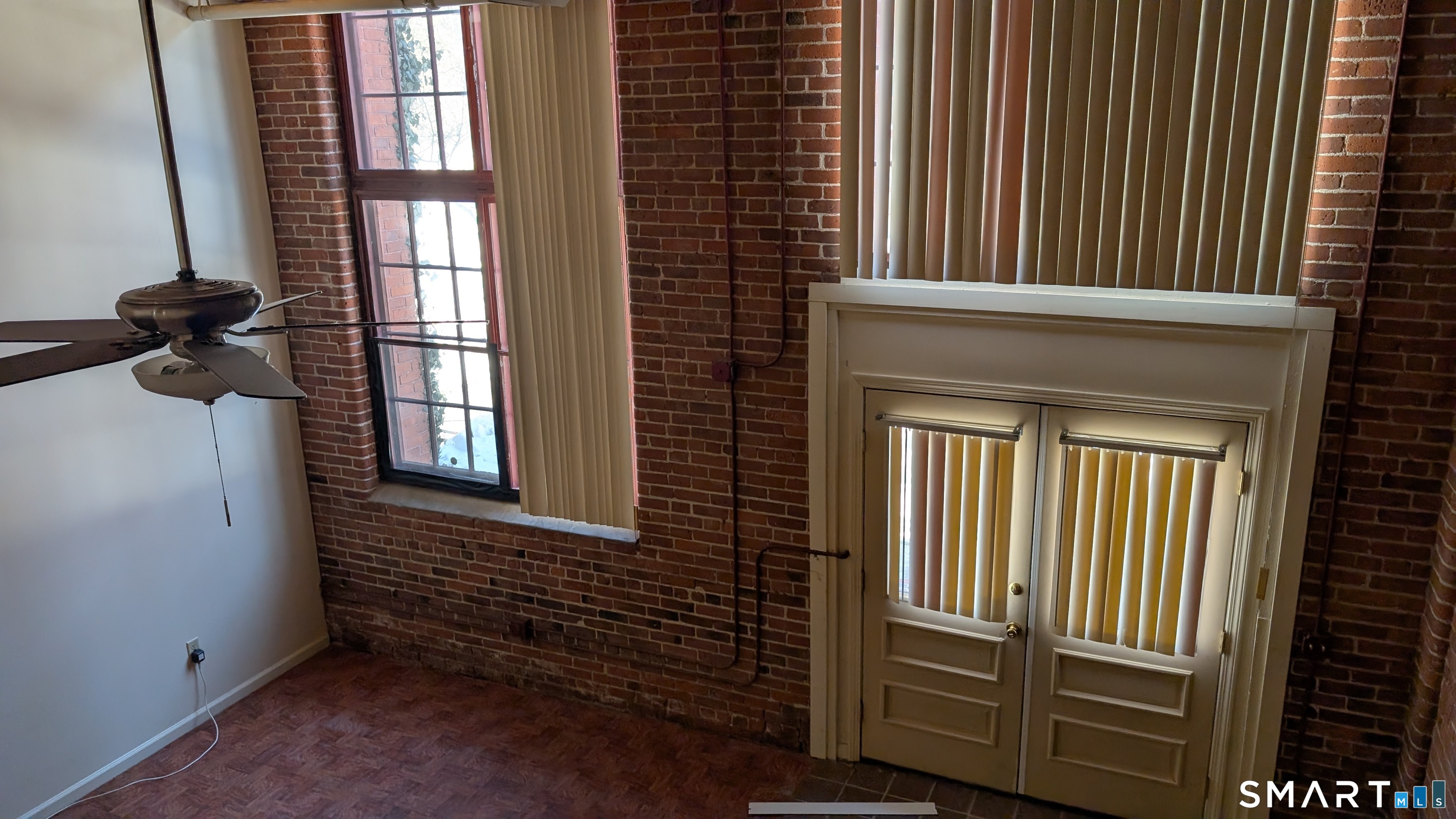 839 Main Street, Unit 98 Torrington, CT 06790 - Photo 17 of 49 a view of wooden floor and a window in a room