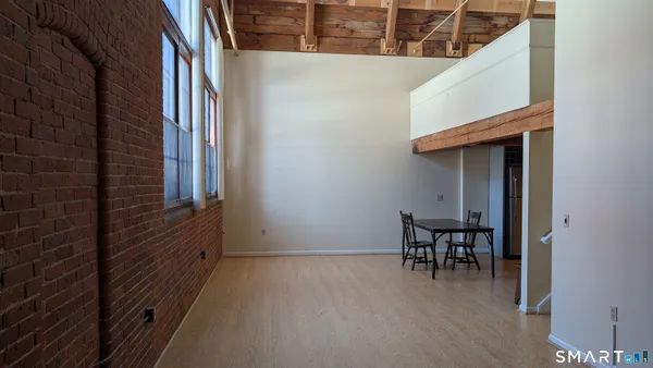 a view of a room that has a bench in it