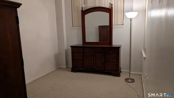 a room with a mirror and a sink
