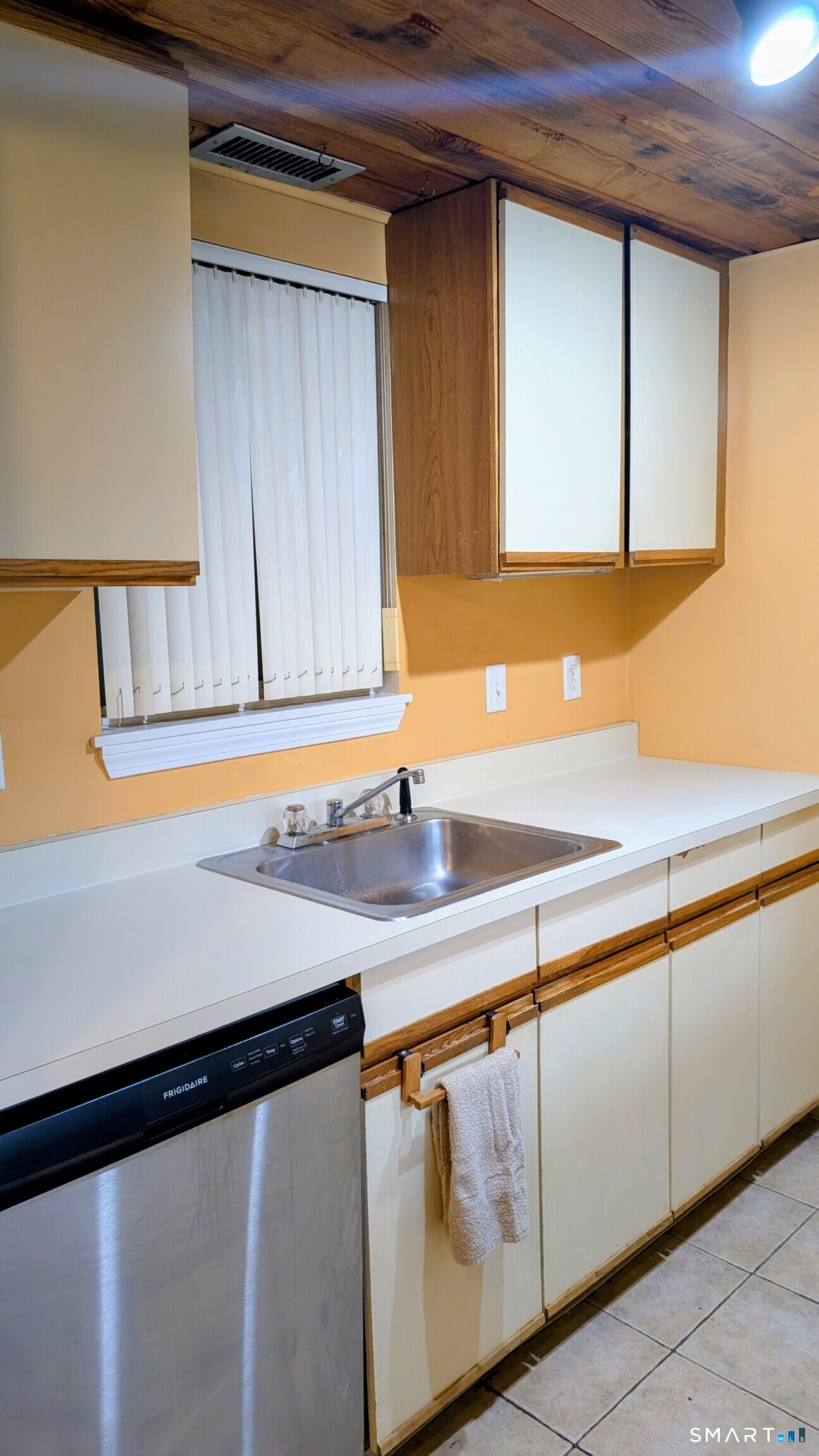 839 Main Street, Unit 98 Torrington, CT 06790 - Photo 49 of 49 a kitchen with a sink and a mirror