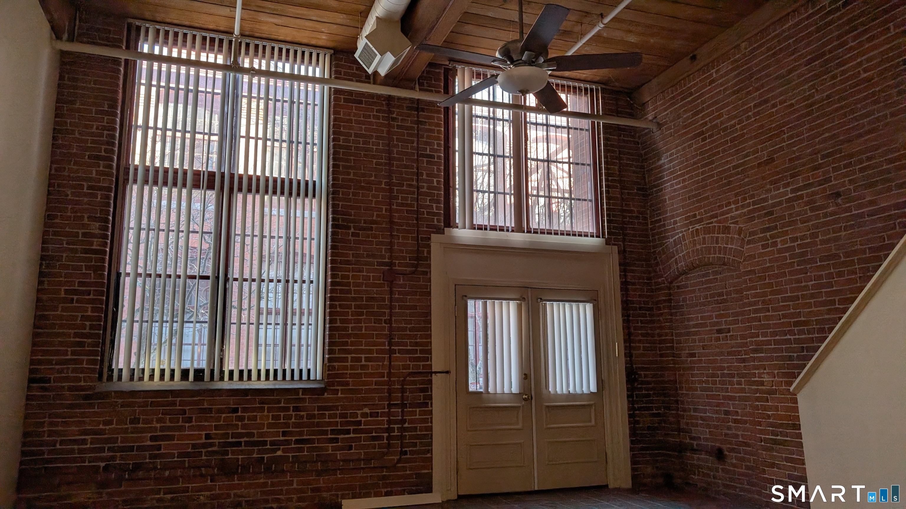 839 Main Street, Unit 98 Torrington, CT 06790 - Photo 6 of 49 a view of a windows and brick walls