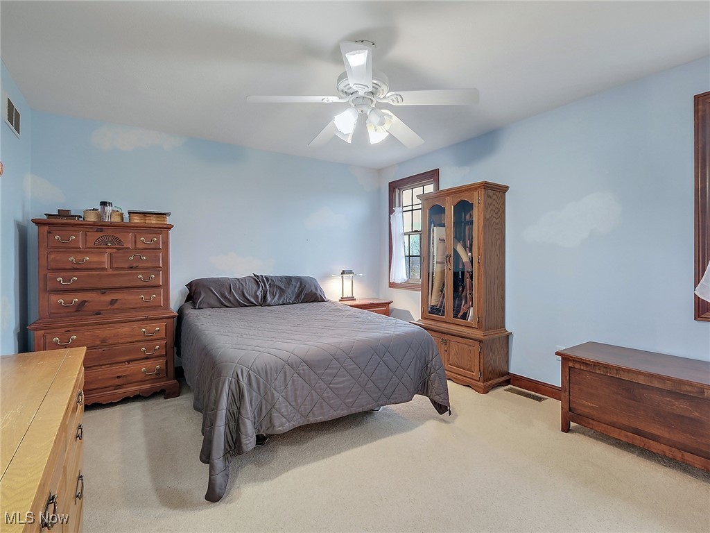 9659 Yoder Road Southwest Sugarcreek, OH 44681 - Photo 20 of 39 Carpeted bedroom with ceiling fan