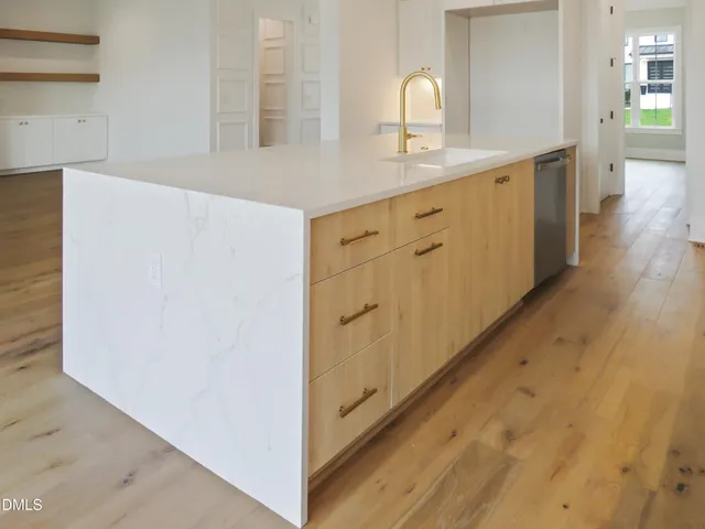 a view of a livingroom with a ceiling fan and a fireplace