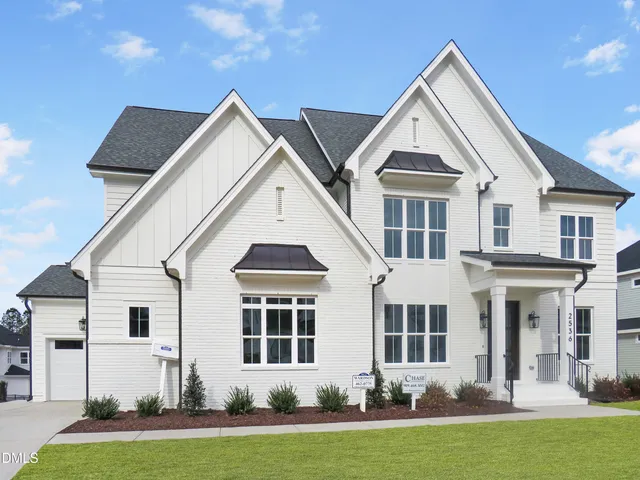 a room with a fireplace and cabinets