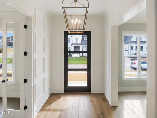 a kitchen with kitchen island a sink stainless steel appliances and a counter top space