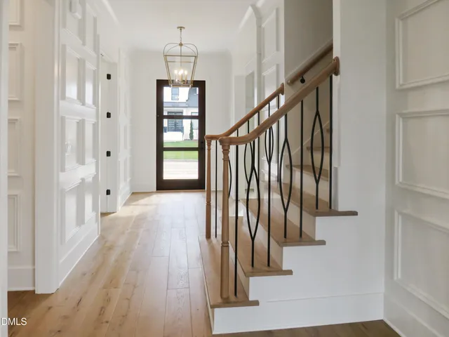 a bathroom with a double vanity sink and mirror