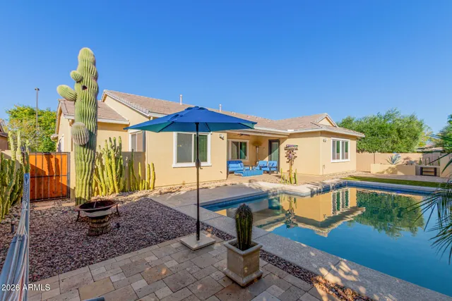 a view of swimming pool with a chair and table