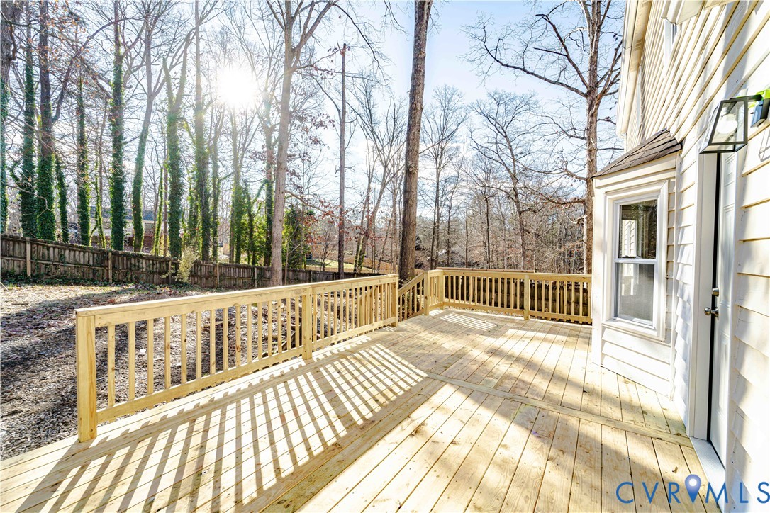 3025 Maplevale Road Chester, VA 23831 - Photo 14 of 14 Spacious wooden deck with a natural wood railing,