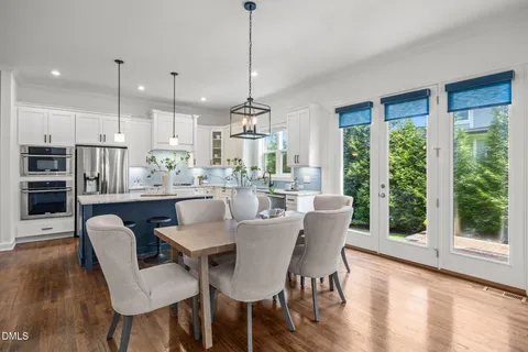 a dining room with furniture window wooden floor