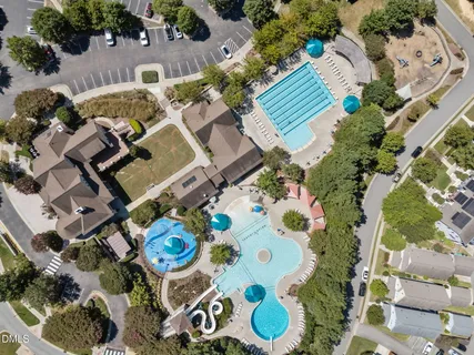 an aerial view of residential house with outdoor space and parking