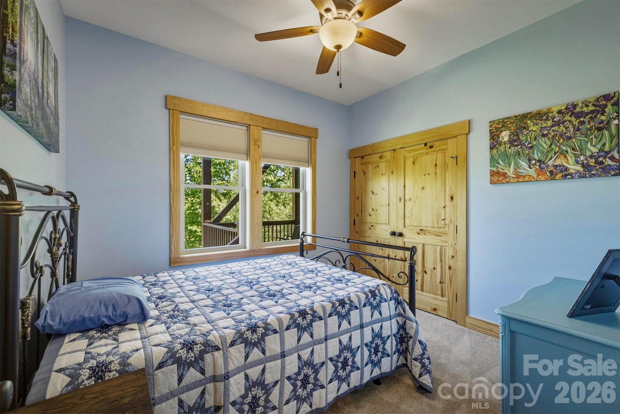 5564 Table View Lane Lenoir, NC 28645 - Photo 24 of 48 a bedroom with a bed and a chandelier