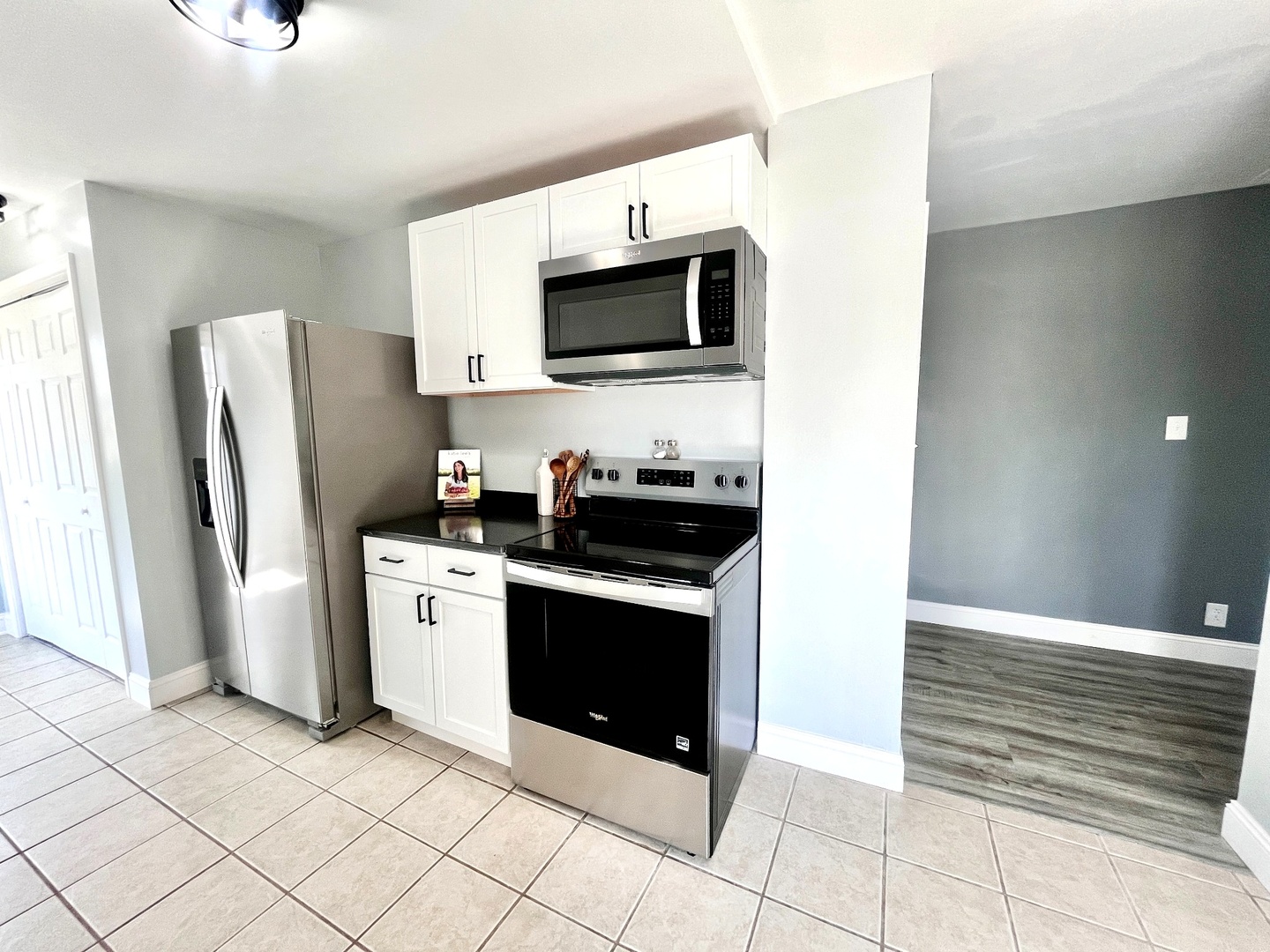 528 West 20th Street Metropolis, IL 62960 - Photo 12 of 26 a kitchen with stainless steel appliances a stove microwave and refrigerator
