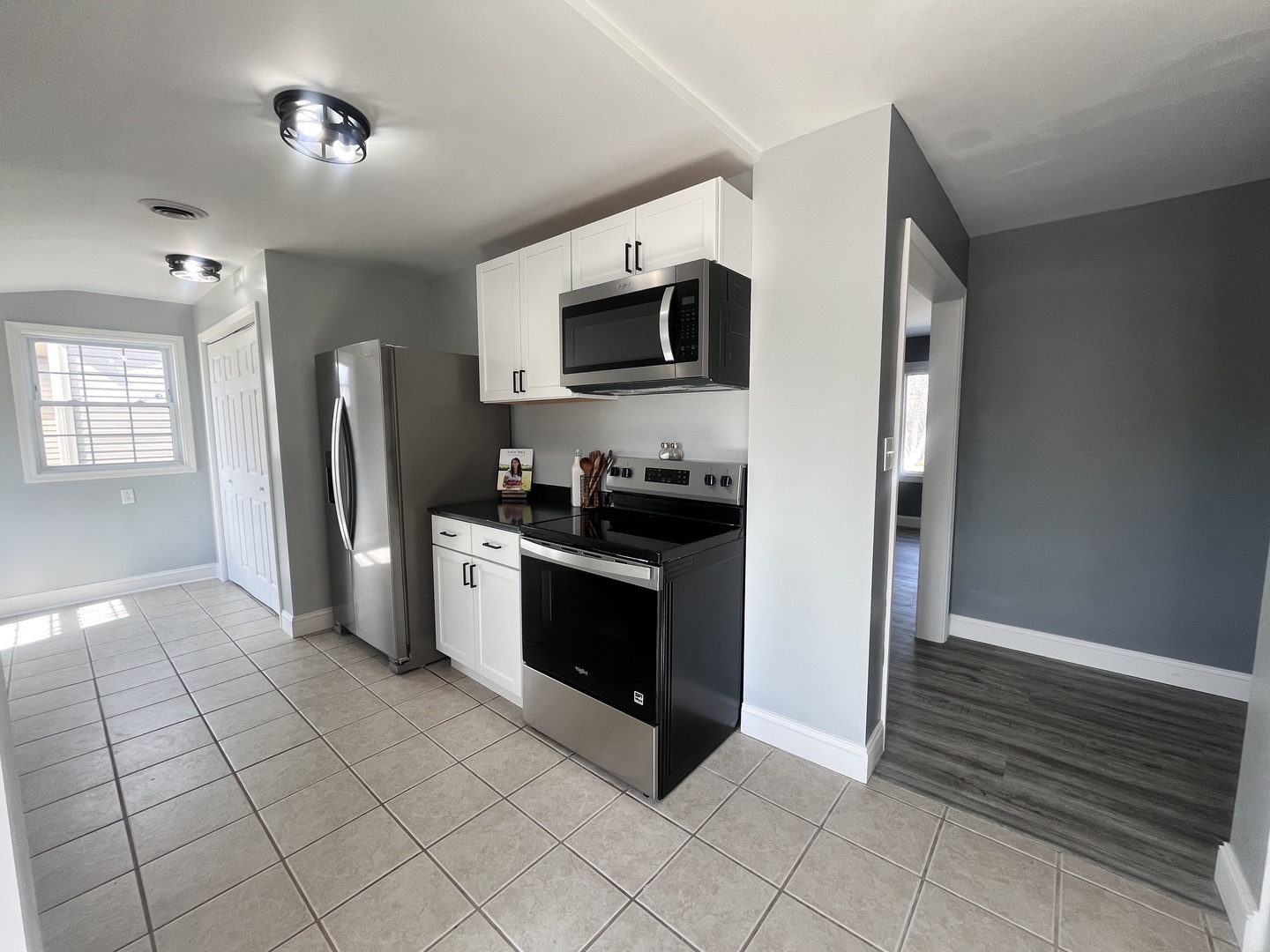 528 West 20th Street Metropolis, IL 62960 - Photo 13 of 26 a kitchen with stainless steel appliances granite countertop a refrigerator and a stove top oven