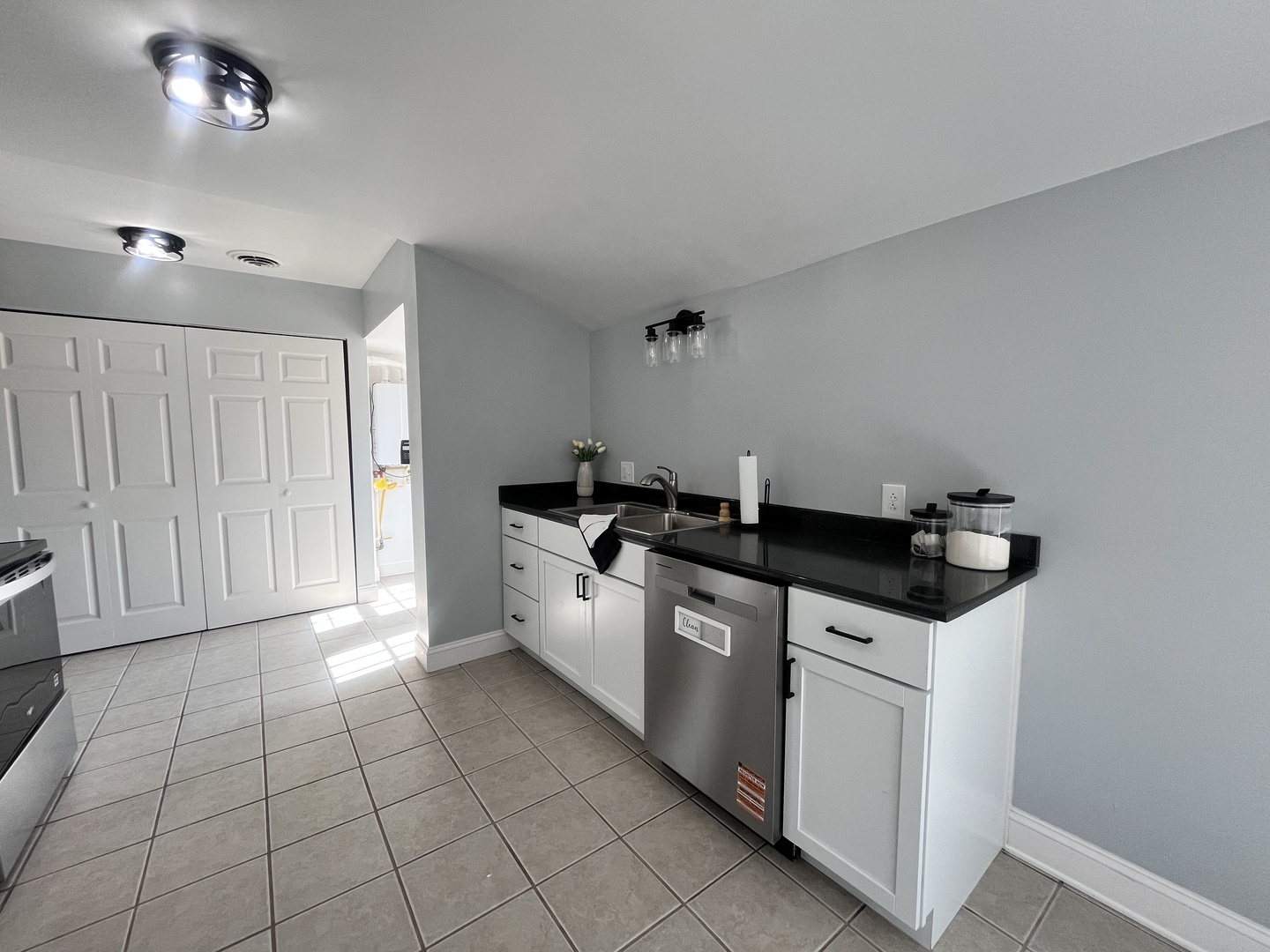 528 West 20th Street Metropolis, IL 62960 - Photo 14 of 26 a kitchen with granite countertop a sink and a stove top oven