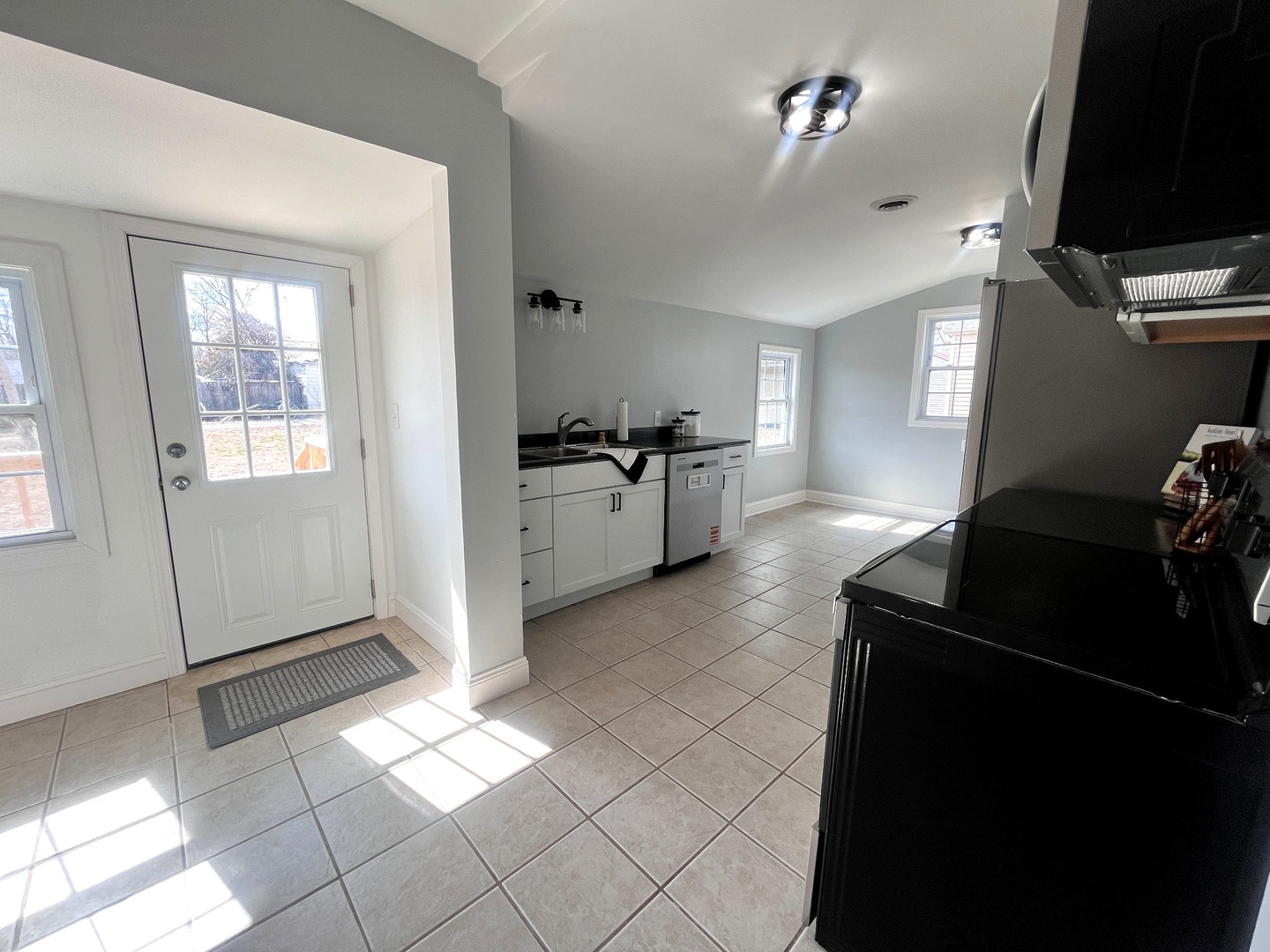 528 West 20th Street Metropolis, IL 62960 - Photo 15 of 26 a kitchen with granite countertop a refrigerator and a stove top oven