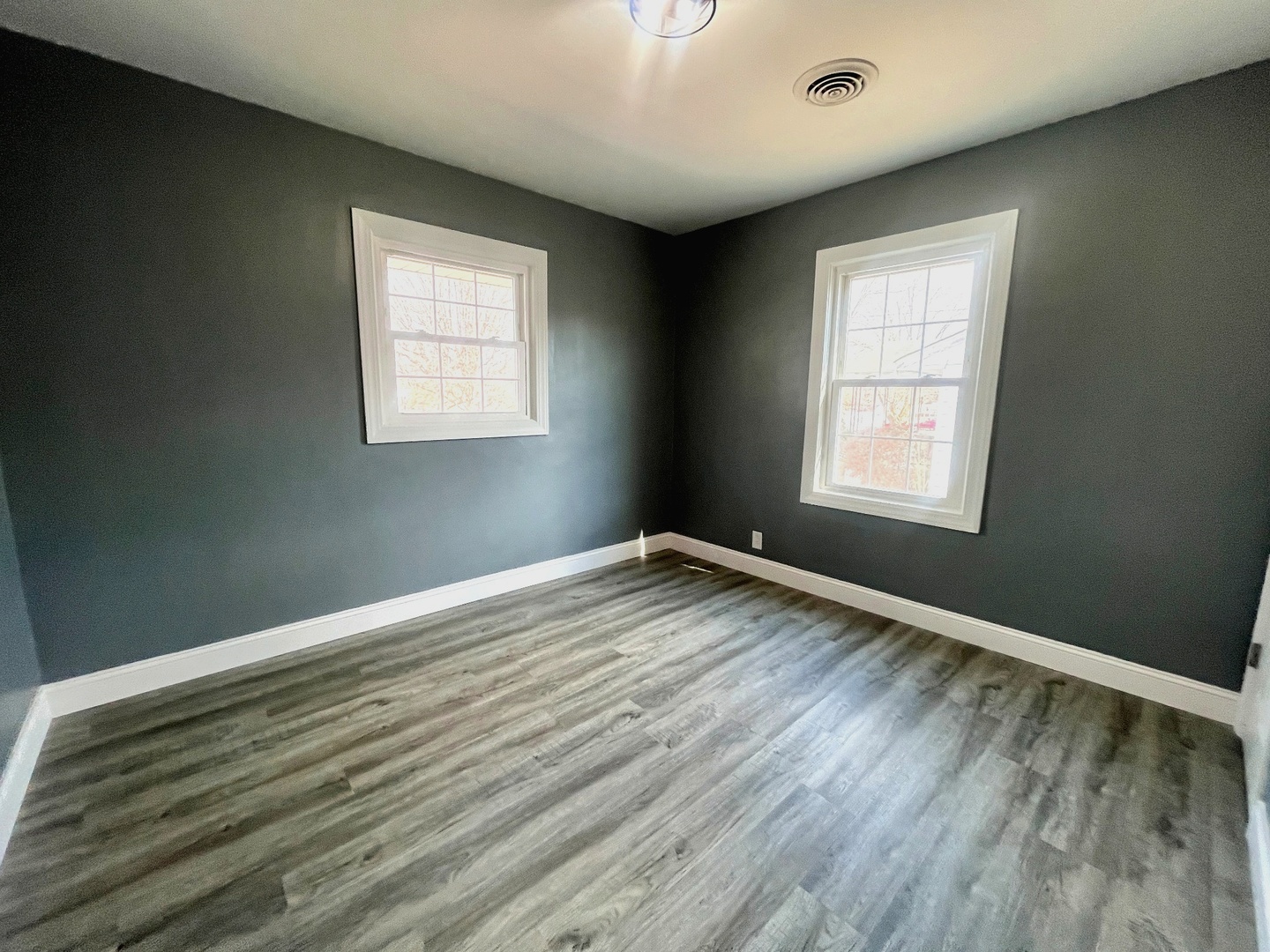 528 West 20th Street Metropolis, IL 62960 - Photo 22 of 26 a view of empty room with wooden floor and fan