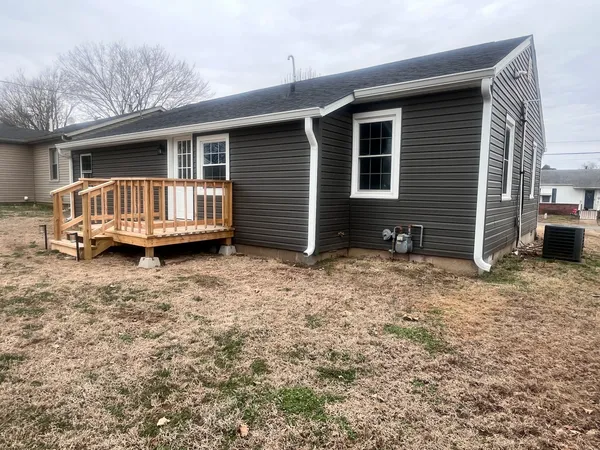 a view of backyard with deck