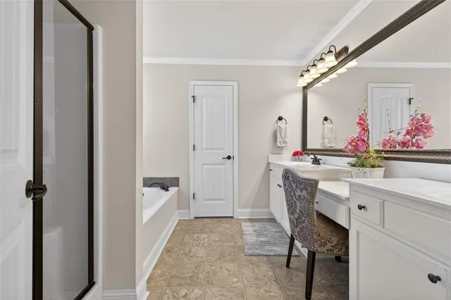 a bathroom with a bathtub and shower