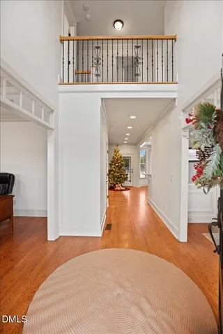 a view of a living room and entryway with wooden floor