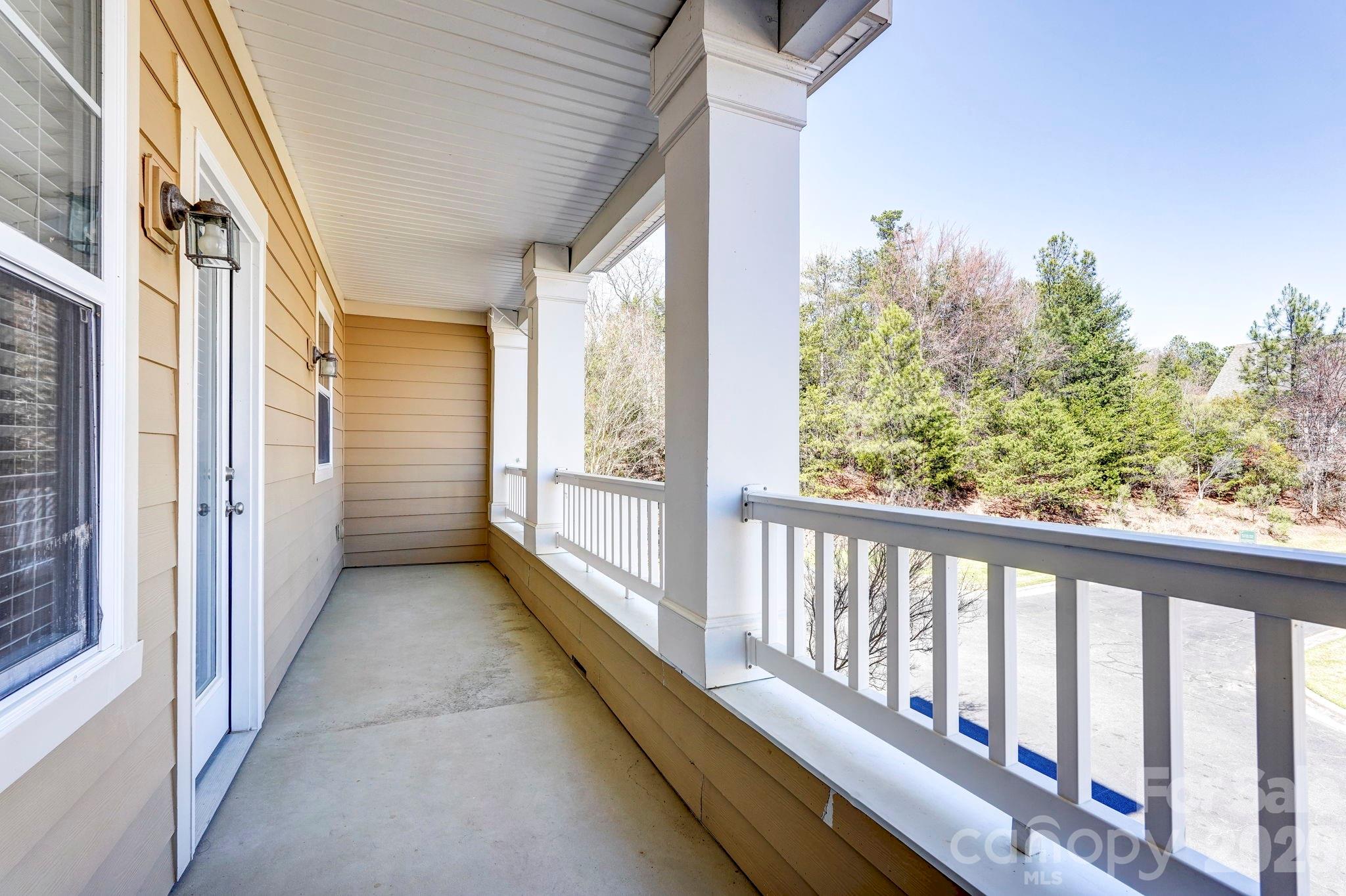 627 Sunfish Lane Tega Cay, SC 29708 - Photo 16 of 42 a view of a balcony with wooden floor