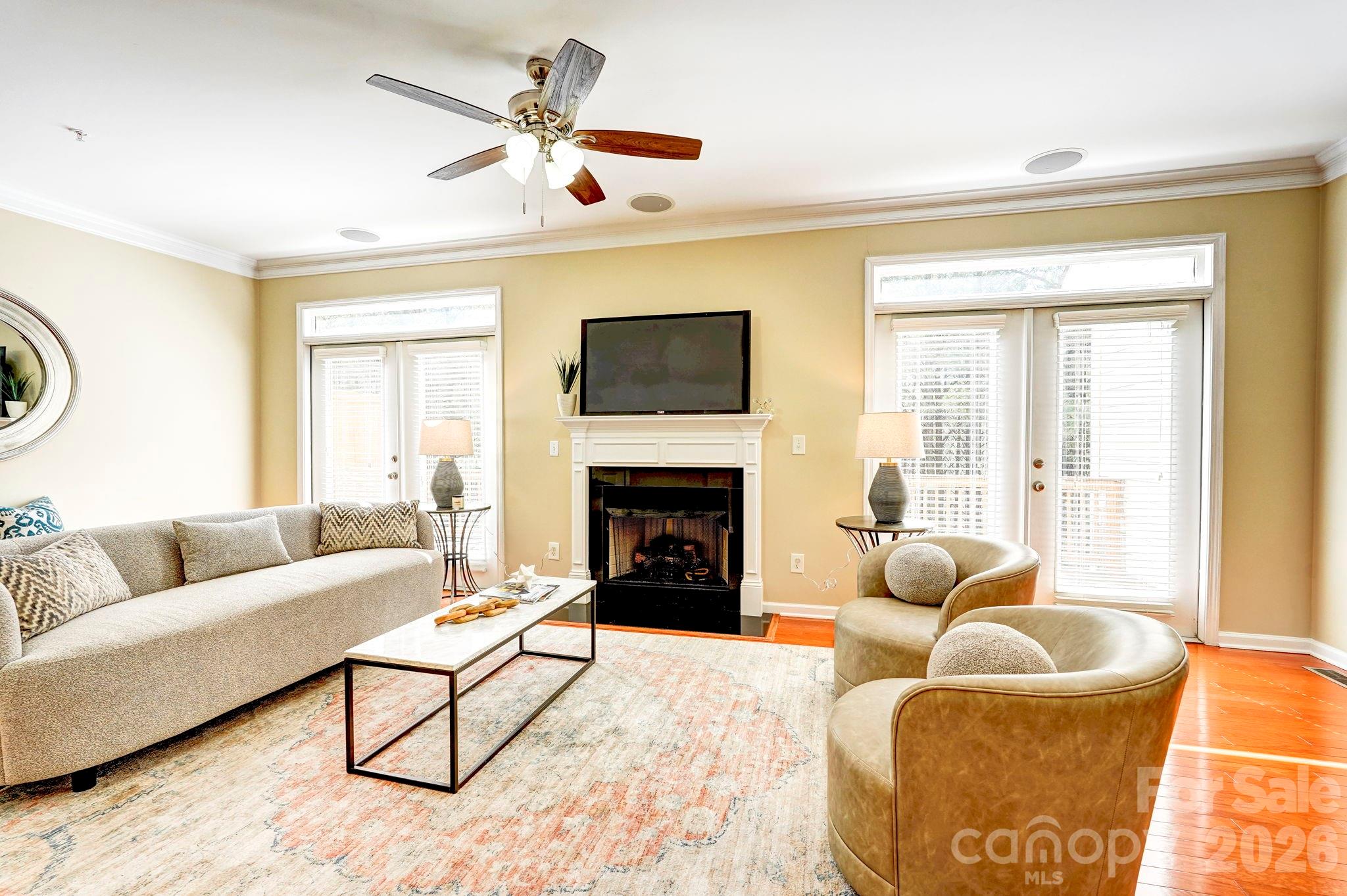 627 Sunfish Lane Tega Cay, SC 29708 - Photo 18 of 42 a living room with furniture a flat screen tv and a fireplace