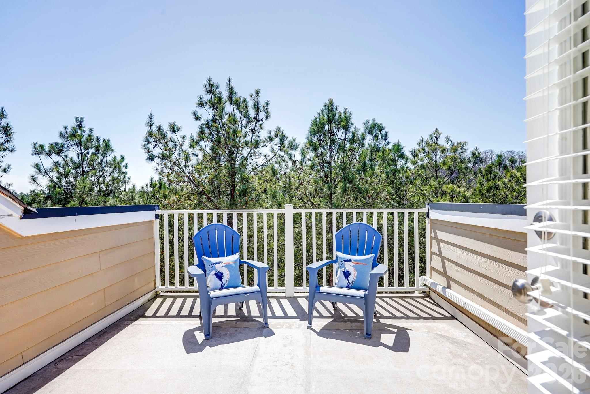 627 Sunfish Lane Tega Cay, SC 29708 - Photo 38 of 42 a view of a chairs and table on the balcony
