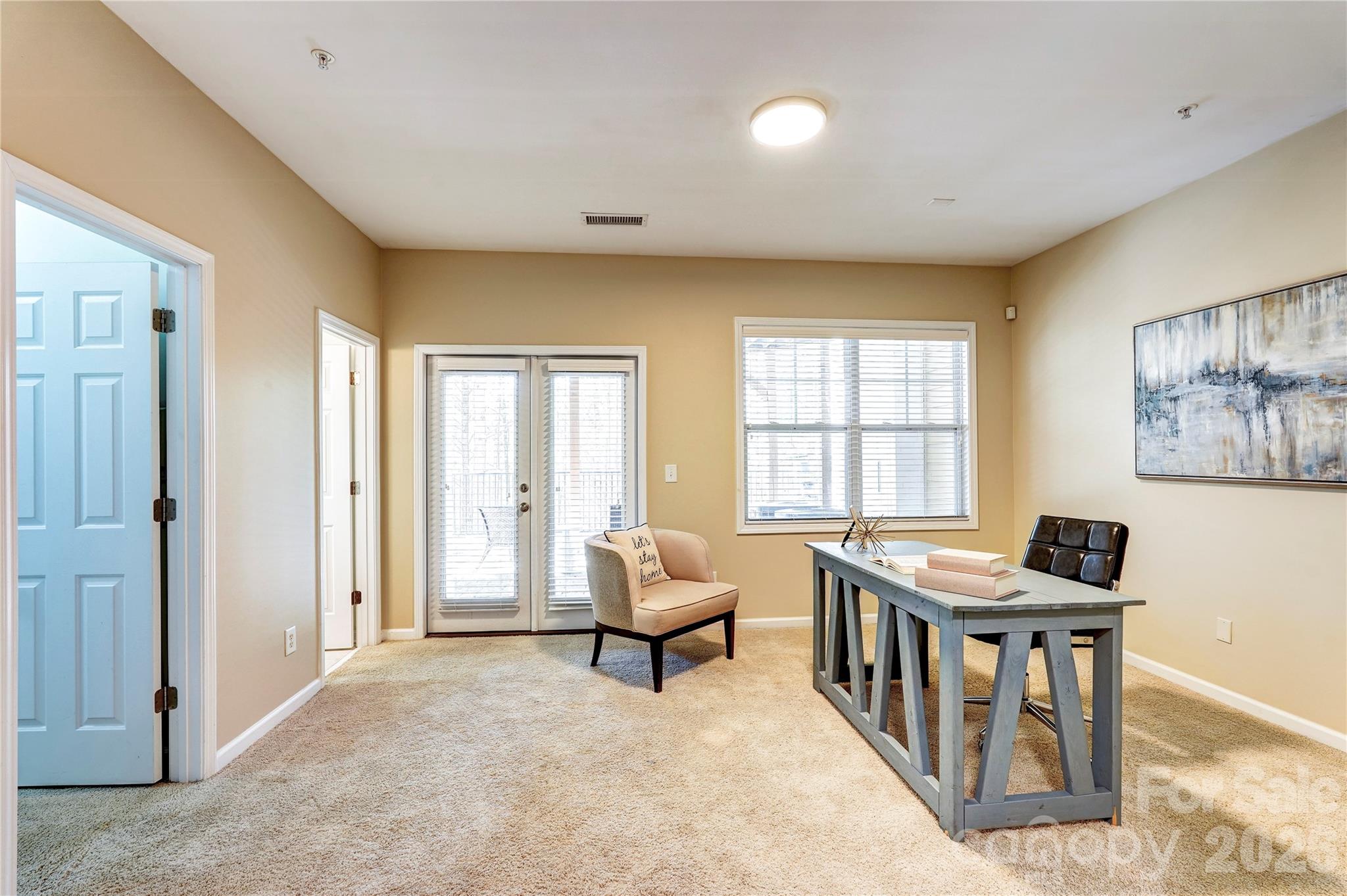 627 Sunfish Lane Tega Cay, SC 29708 - Photo 5 of 42 a living room with furniture and floor to ceiling windows