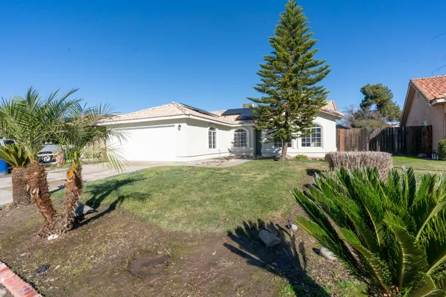a house view with a garden space