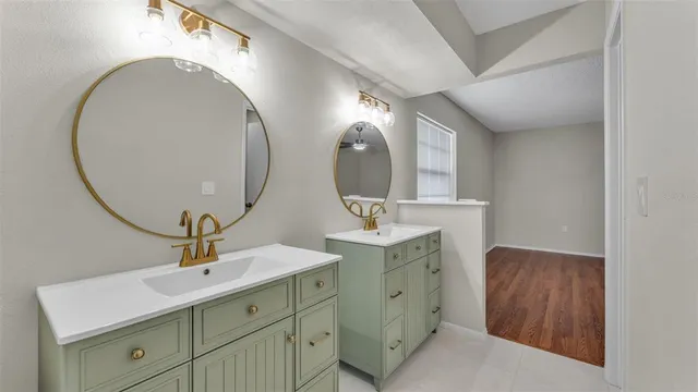 a bathroom with a double vanity sink and a mirror