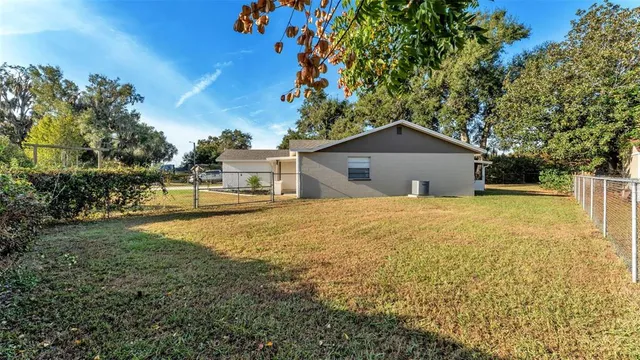 a house with trees in the background