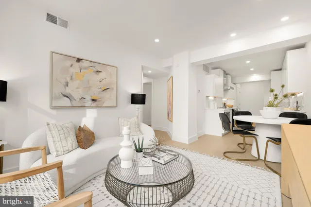 a living room with furniture and a table