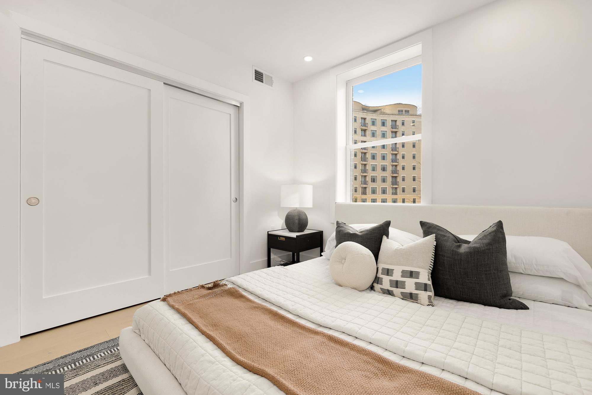 2116 Kalorama Road Northwest, Unit 205 Washington, DC 20008 - Photo 17 of 33 a bedroom with a bed and a window
