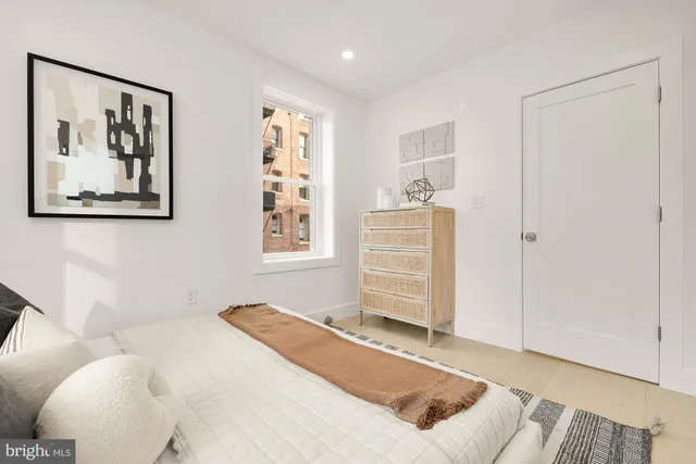 a bedroom with a bed and furniture