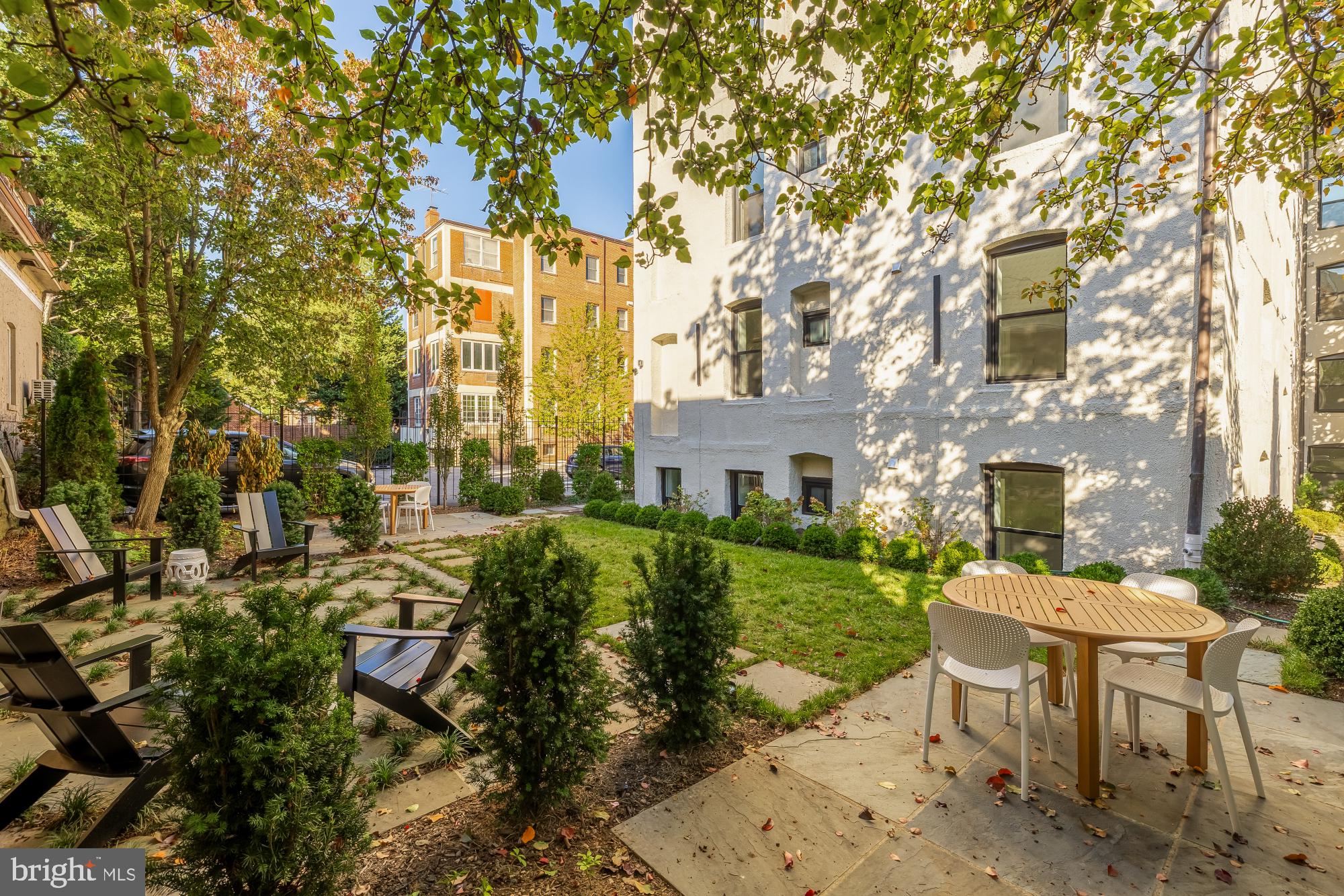 2116 Kalorama Road Northwest, Unit 205 Washington, DC 20008 - Photo 32 of 33 a view of a patio with table and chairs and potted plants