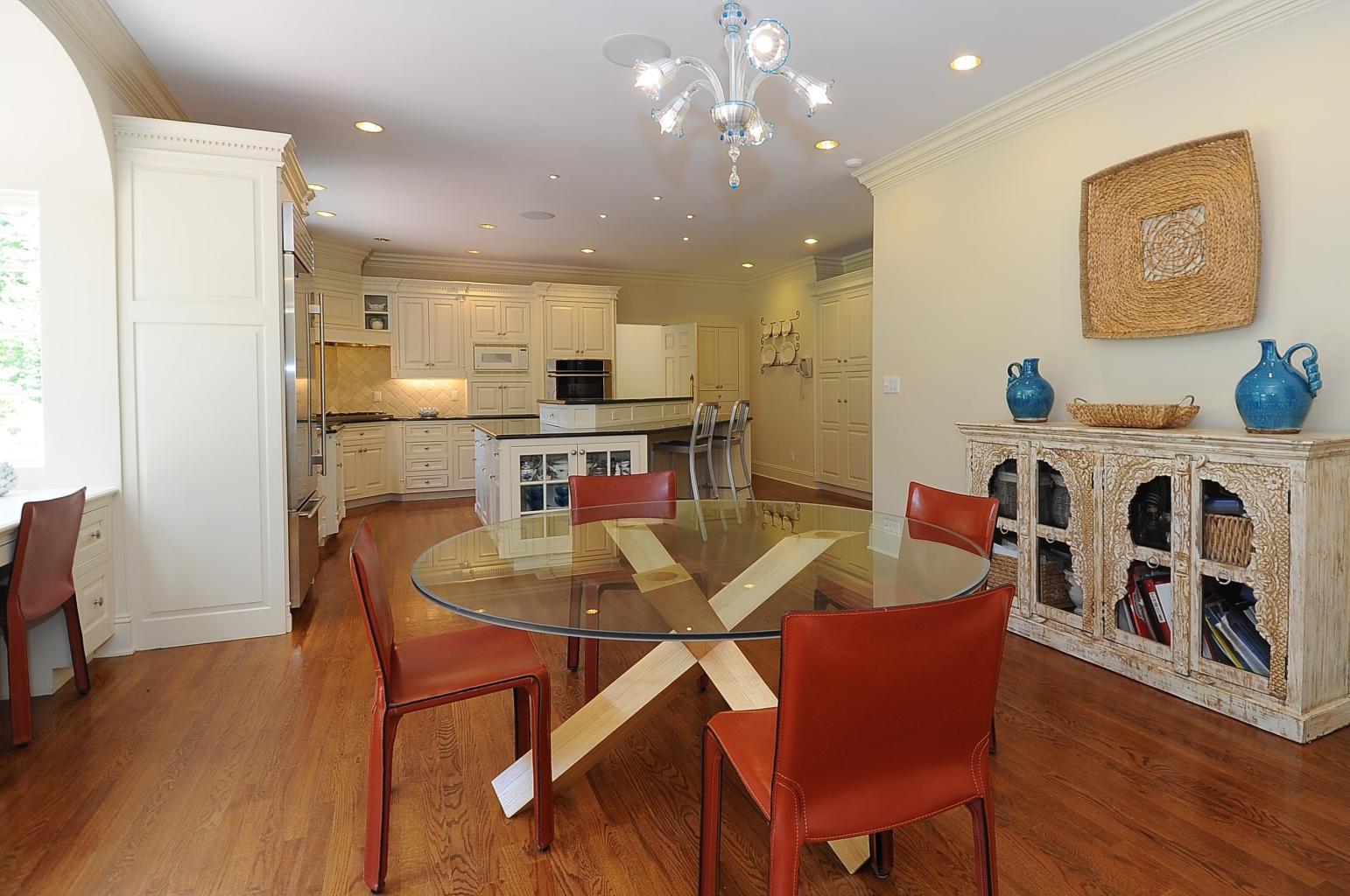 262 Lukes Wood Road New Canaan, CT 06840 - Photo 13 of 34 a view of a dining room with furniture and wooden floor