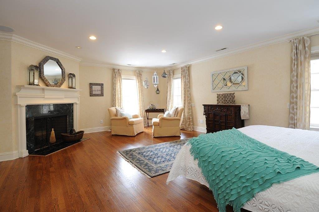 262 Lukes Wood Road New Canaan, CT 06840 - Photo 15 of 34 a living room with furniture and a fireplace