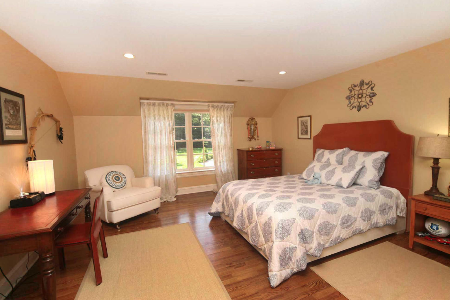 262 Lukes Wood Road New Canaan, CT 06840 - Photo 18 of 34 a bedroom with double bed and a couch