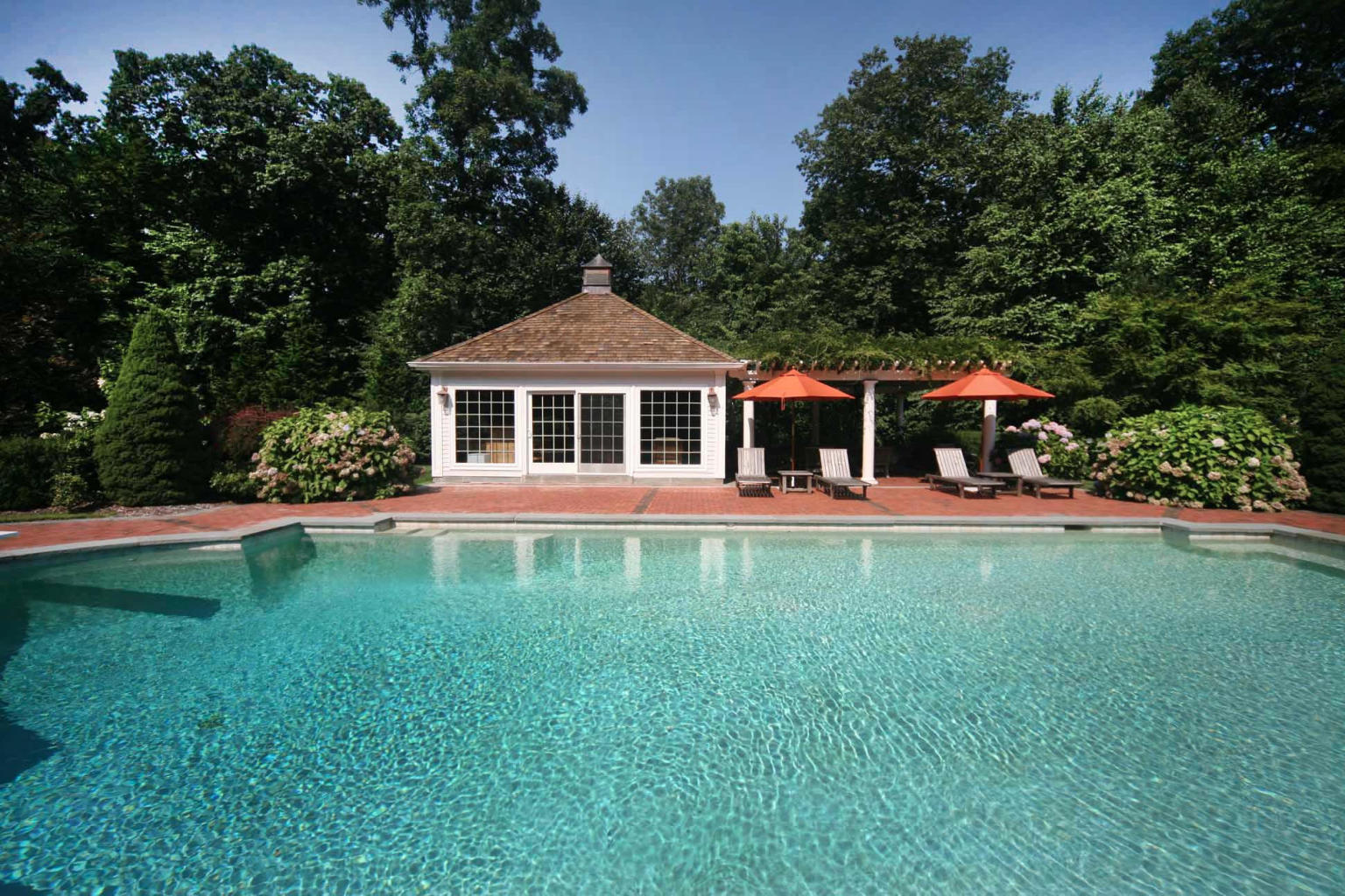 262 Lukes Wood Road New Canaan, CT 06840 - Photo 19 of 34 a front view of a house with garden