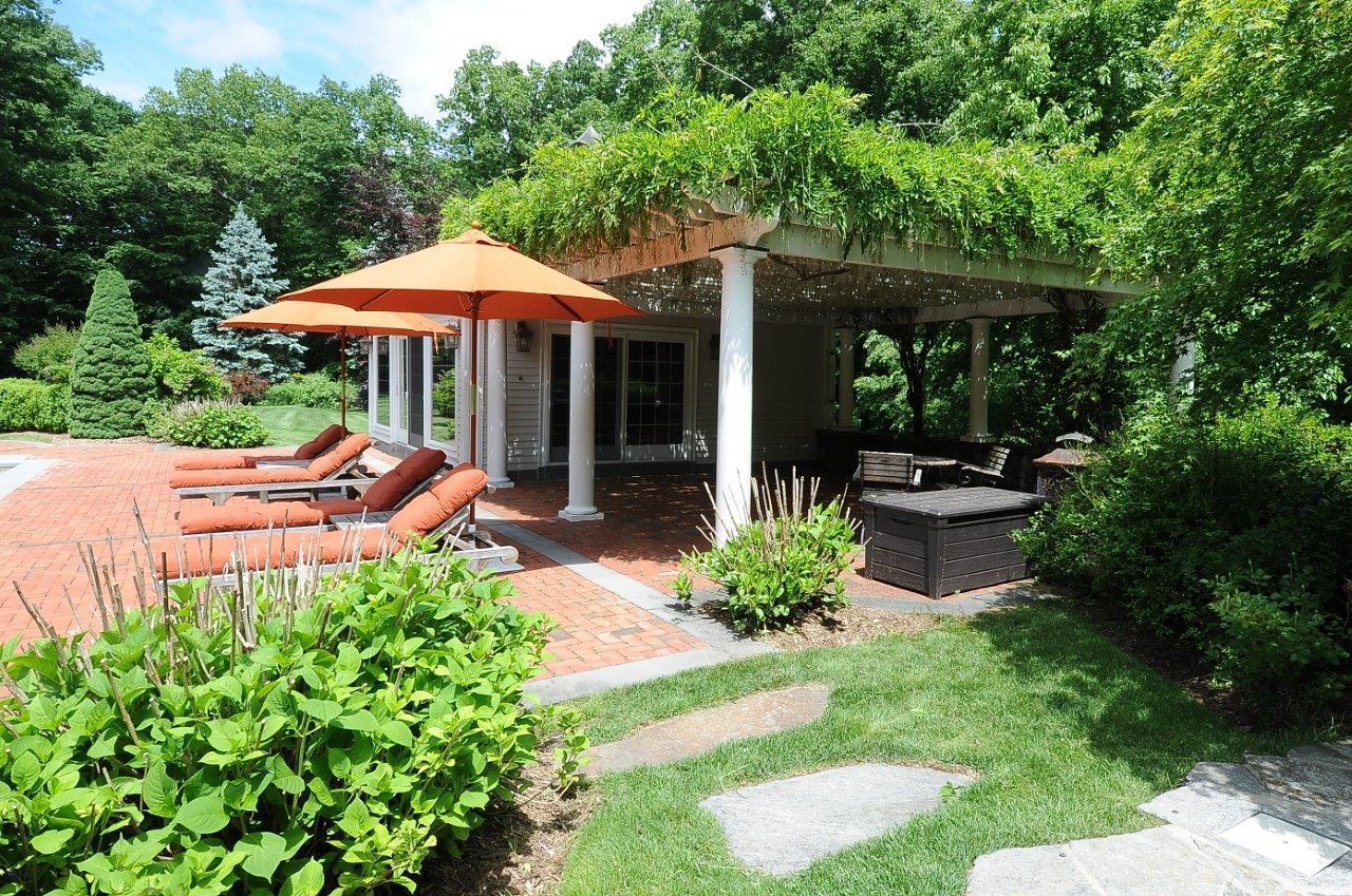 262 Lukes Wood Road New Canaan, CT 06840 - Photo 28 of 34 a garden view with a seating space