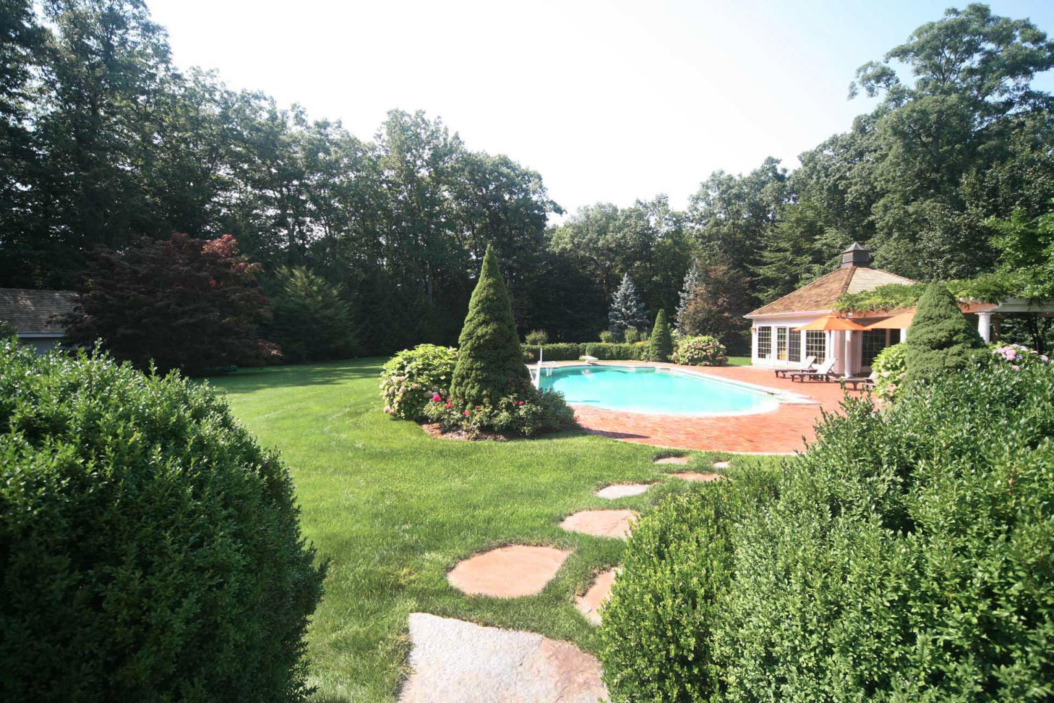 262 Lukes Wood Road New Canaan, CT 06840 - Photo 29 of 34 a view of a house with a backyard