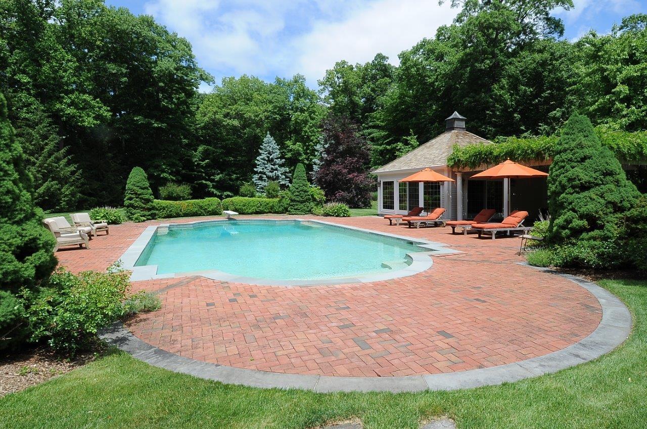 262 Lukes Wood Road New Canaan, CT 06840 - Photo 3 of 34 a view of a house with a swimming pool and sitting area