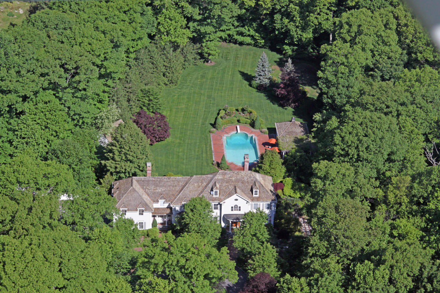 262 Lukes Wood Road New Canaan, CT 06840 - Photo 33 of 34 an aerial view of a house with a yard