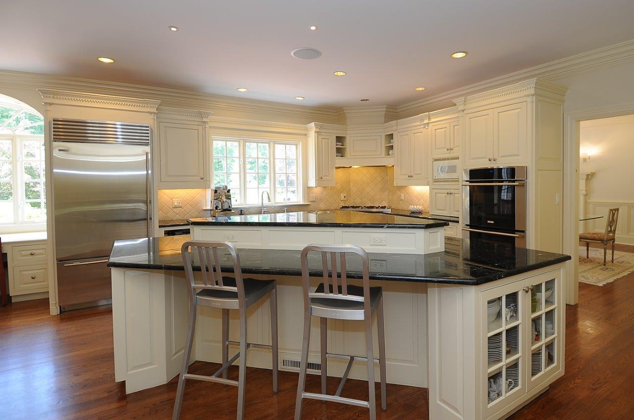262 Lukes Wood Road New Canaan, CT 06840 - Photo 6 of 34 a kitchen with stainless steel appliances granite countertop a sink and a refrigerator
