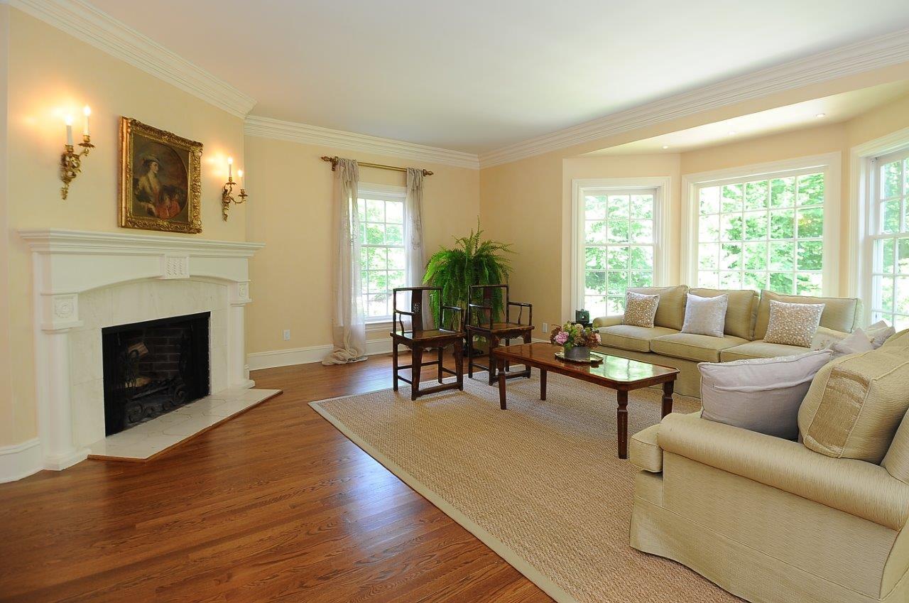 262 Lukes Wood Road New Canaan, CT 06840 - Photo 7 of 34 a living room with furniture and a fireplace