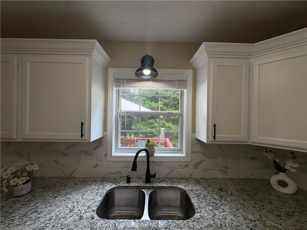 13 Greystone Lane Northwest Cartersville, GA 30121 - Photo 39 of 61 a kitchen with a sink and a window